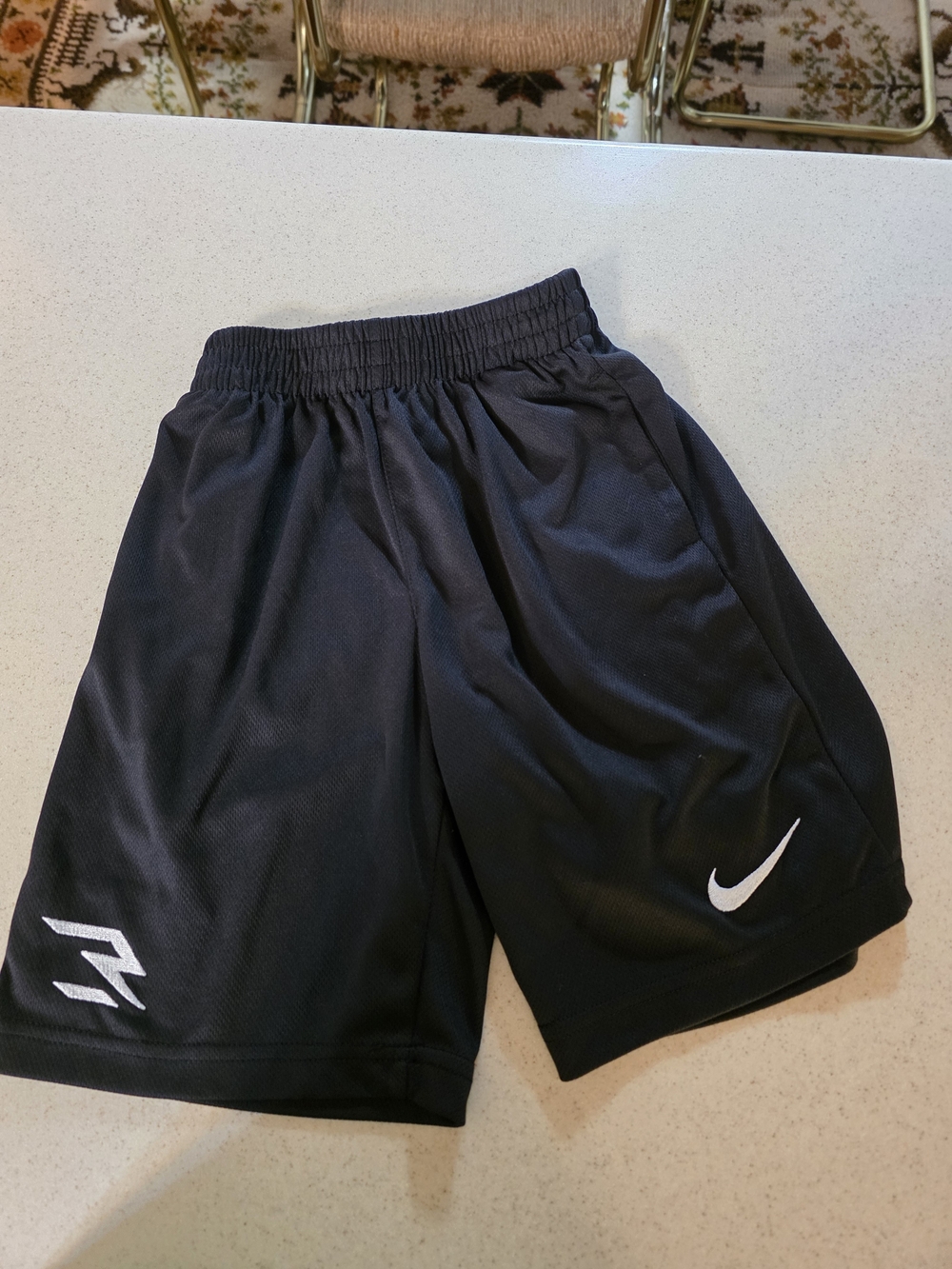 Nike Black Kids Athletic Mesh Shorts with White Swoosh